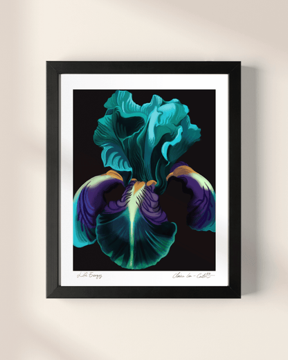 Framed artwork of a vibrant teal and purple iris on a beige wall.