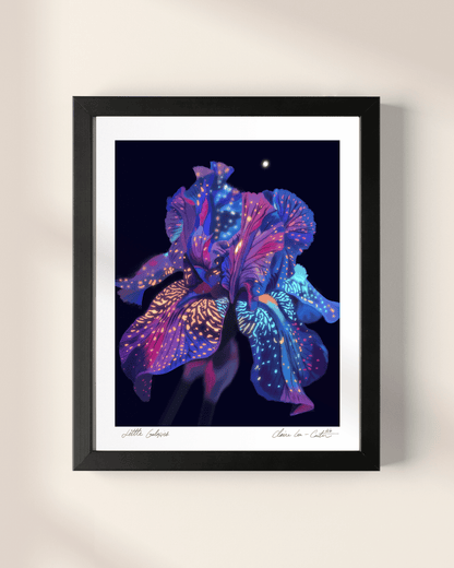 Framed artwork of a rainbow colorful flower that looks galactic like space on a black background with white boarders on a beige wall