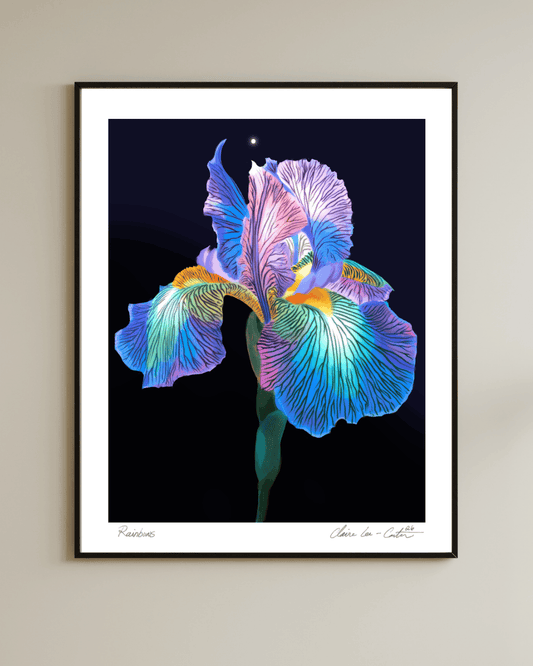 Framed artwork of a rainbow colored iris flower on a beige wall