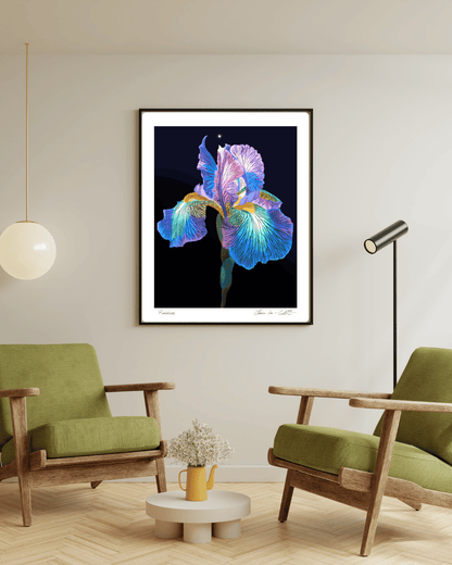 Framed artwork of a rainbow colored iris flower on a beige wall in a modern living room with green chairs and a small table. 